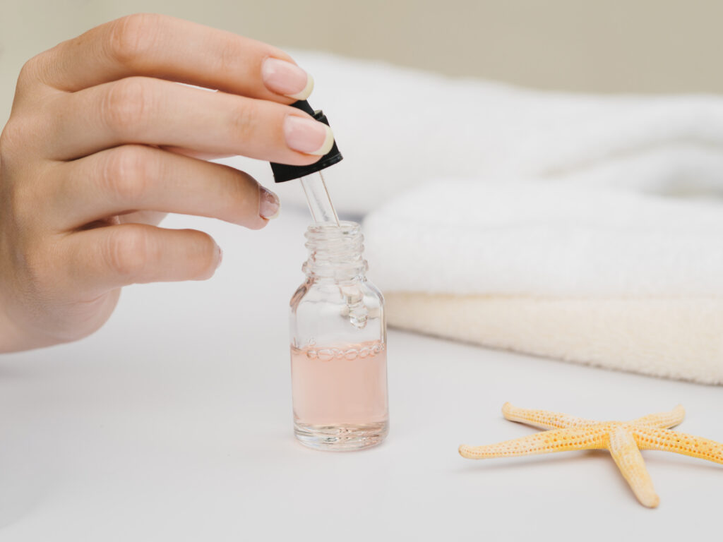 The Secret Science of Your Glow: Professional Skin Biology Research A close-up photograph illustrating Niacinamide skincare science: a clear dropper bottle and laboratory elements with serum applied to healthy skin, emphasizing texture and radiant results